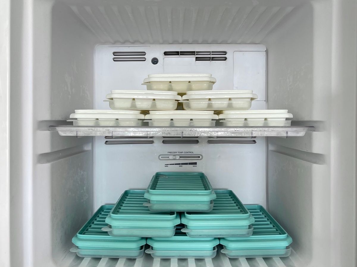 Neatly organized containers inside a freezer, showing freezer-safe meal prep storage