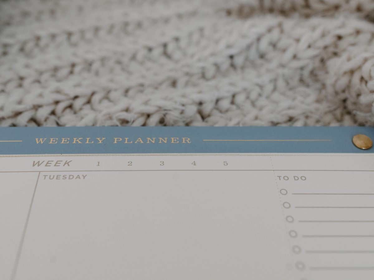 Close-up of a weekly planner page used to slot meals against the calendar when you plan a week of meals for one